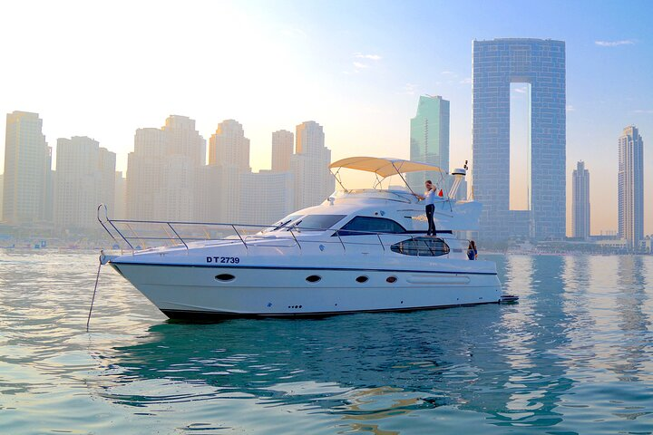 Experience the stunning Dubai skyline as it glows at sunset from your private luxury yacht. Enjoy comfort and style while cruising past iconic landmarks on the sparkling waters.